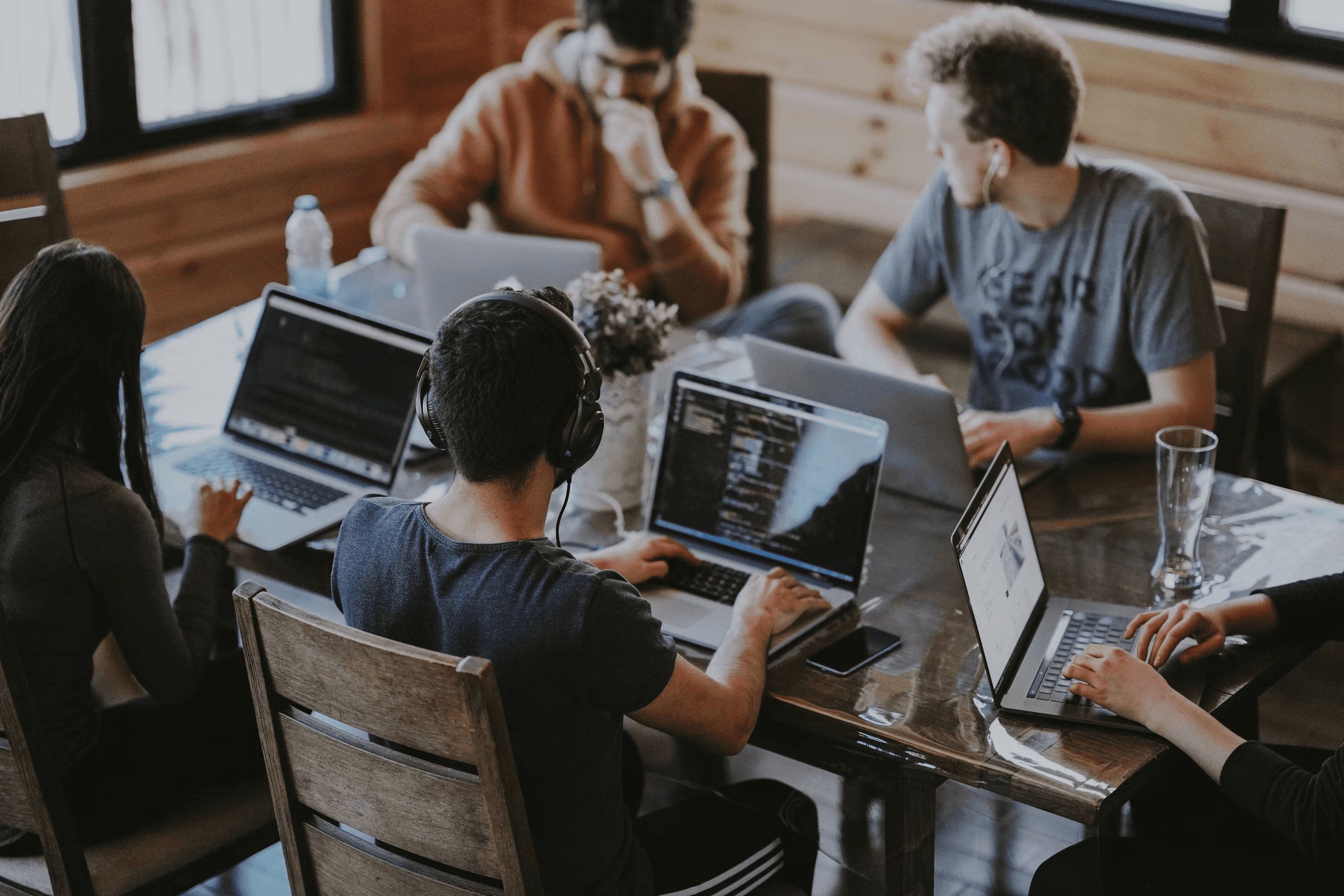 Canary team around laptops